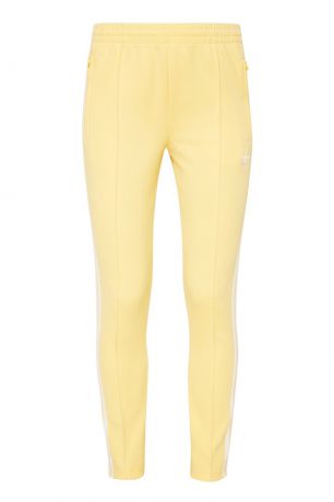 Adidas Желтые спортивные брюки SST