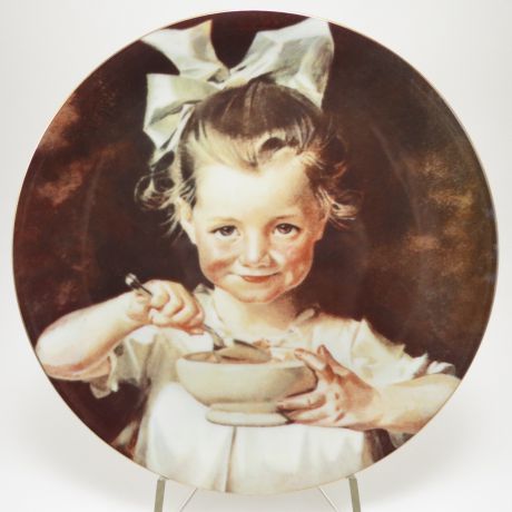 Декоративная тарелка Royalwood China "Девочка с кукурузными хлопьями". Фарфор, деколь. США, Ж. С. Лэйендекер, 1977