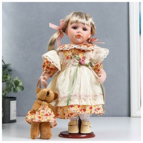 Кукла коллекционная керамика "Иришка в бежево-оранжевом платье с цветами и мишкой" 30 см