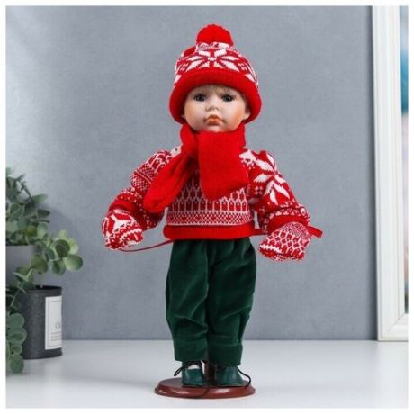 Кукла коллекционная керамика Паша в красном зимнем свитере, шапке и шарфе 30 см