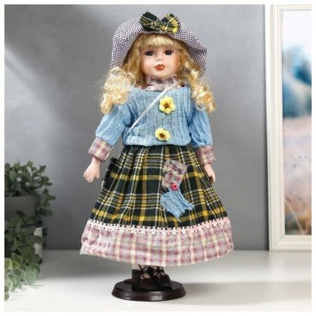 Кукла коллекционная керамика "Блондинка с кудрями, в голубом свитере с цветочками" 40 см