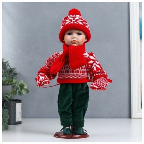 Кукла коллекционная керамика "Паша в красном зимнем свитере, шапке и шарфе" 30 см