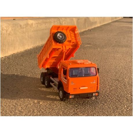 Игрушечный камаз 6520 самосвал оранжевый открываются двери откидывается кузов поднимается кабина свет/звук