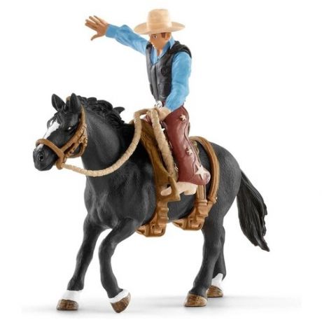 Фигурка Schleich Ковбой в седле на необъезженной лошади