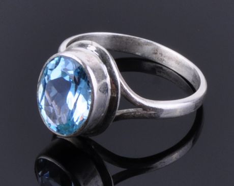 Кольцо серебро с голубым топазом "Галос"